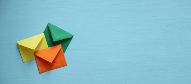 istock Close-up of color envelopes on blue background 1280807157