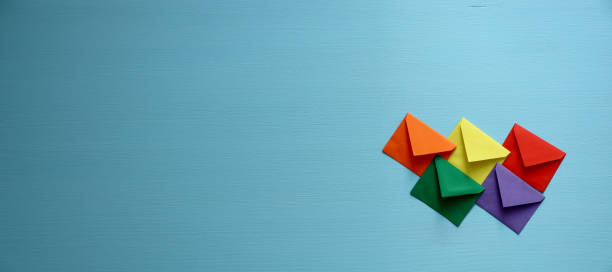 Close-up of color envelopes on blue background