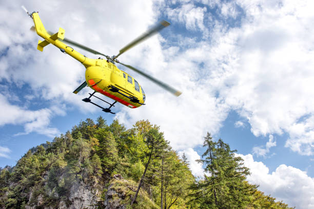 istock Yellow helicopter on background of high Alps. 1280809004