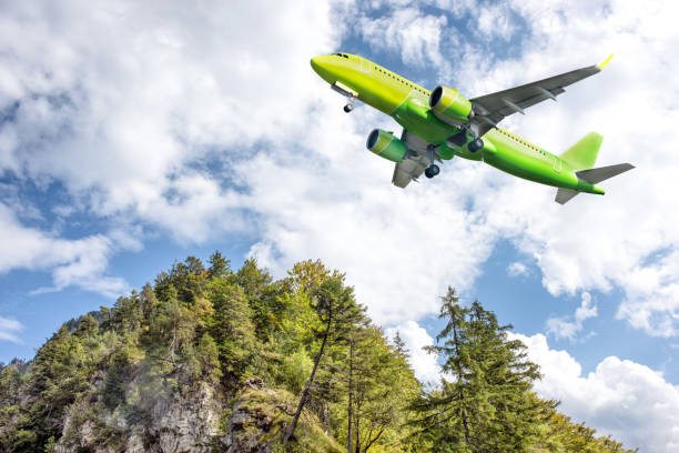 istock A big yellow jet flying over mountains. 1280809013