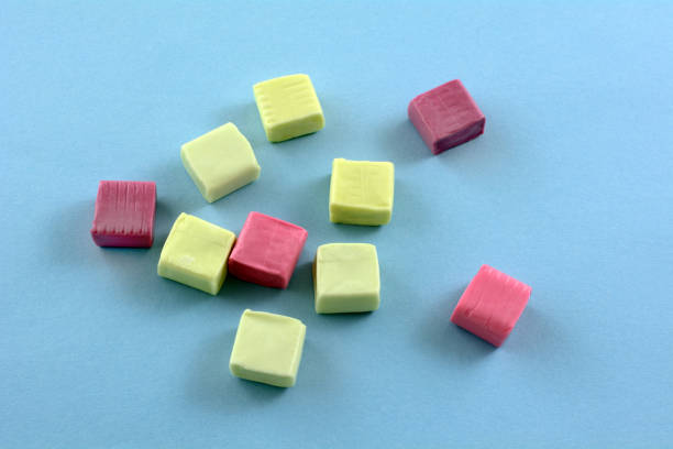 Fruit juice chew candies on blue background