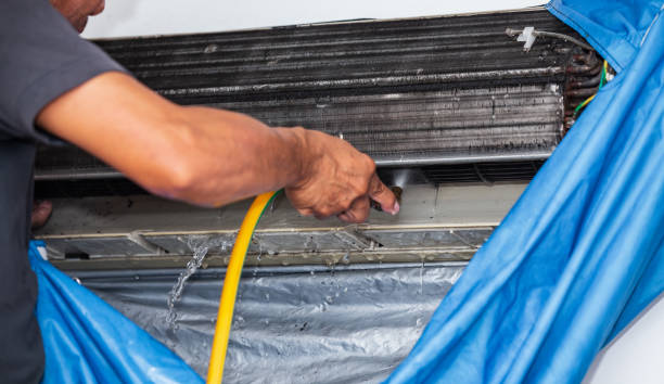 istock Male technician cleaning dirty air conditioner 1280818876