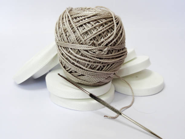istock white ribbon and white thread on a white background 1280822160