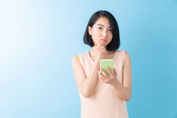istock asian woman to see a smart phone,think, 1280824729