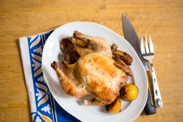 istock Roast Chicken on Platter with Lemons 1280826367
