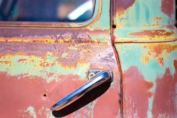 Photo of Vintage Red and Green Truck Door (Close-Up)