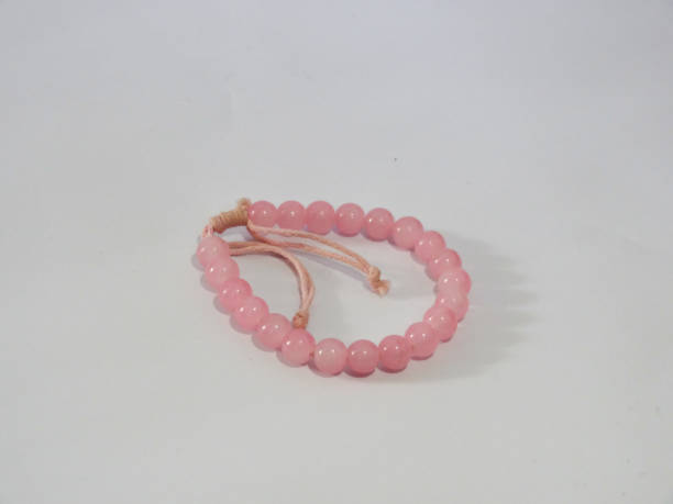 istock bracelet in pink on white background 1280828663