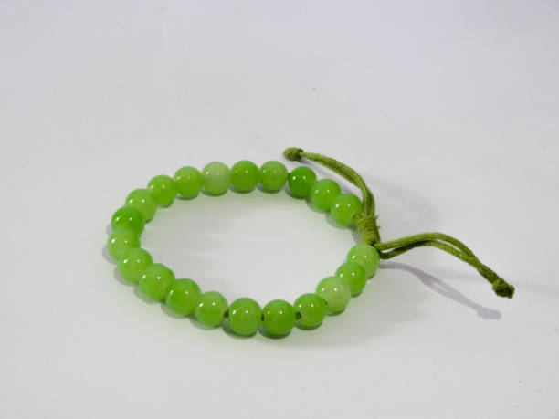 istock bracelet in green on white background 1280829487