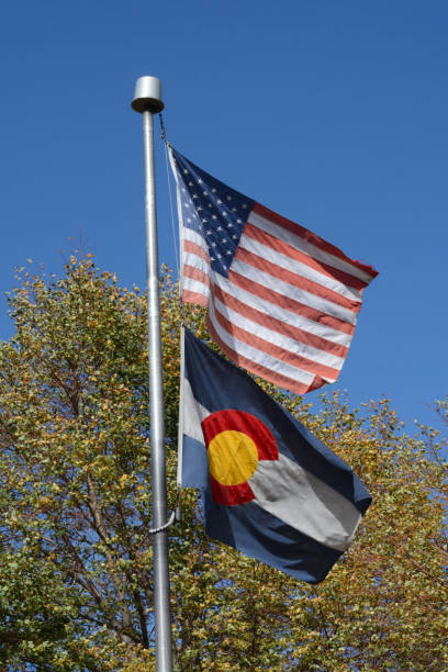 istock American flag and Colorado state flag 1280835088