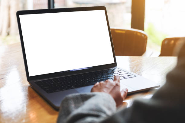 istock a woman touching on laptop computer touchpad with blank white desktop screen on wooden table 1280838816