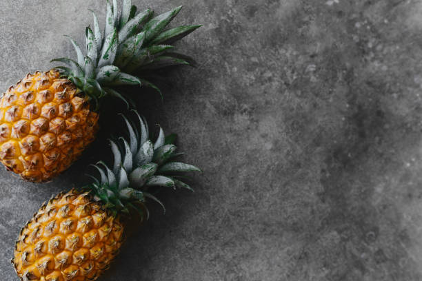 istock Pineapple on a stone table. Tropical Fruits. 1280840339