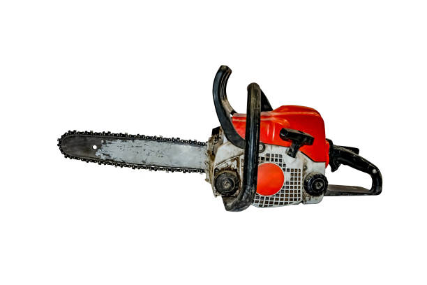 Old dirty shabby chainsaw isolated on white background - side view stock photo