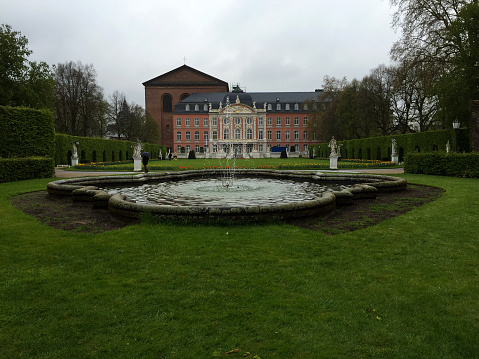 The Electoral Palace with the garden and main pond in Trier Germany