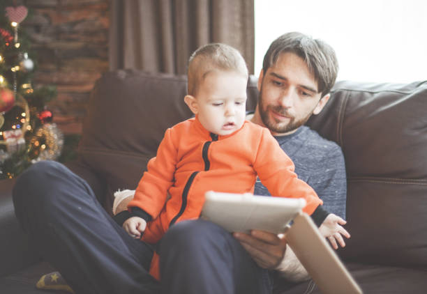 istock toddler boy playing with dad at home 1280844482