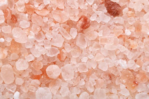 istock Coarse himalayan pink salt granules macro shot background 1280846278