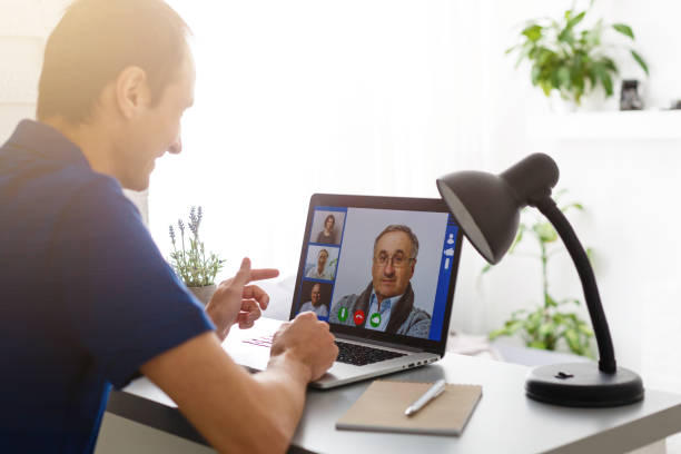 istock Man having video chat with doctor on laptop at home 1280848312