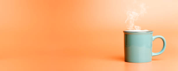 istock Cup minimal concept. Cup with hot coffee or tea on a blank colored banner background. 1280851107