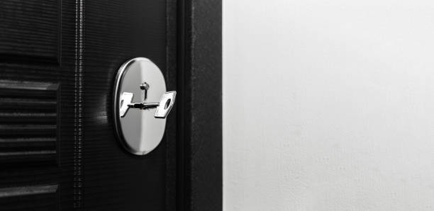 istock Close-up of modern door lock with key inside. Panoramic photo with copy space. 1280851182