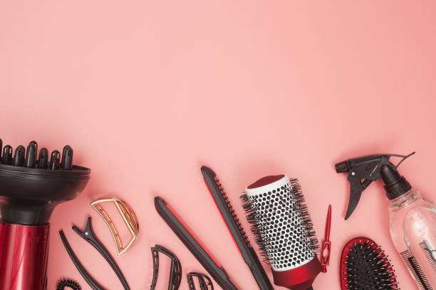 istock professional items for hairdressing, haircuts on a pink background, layout 1280858785