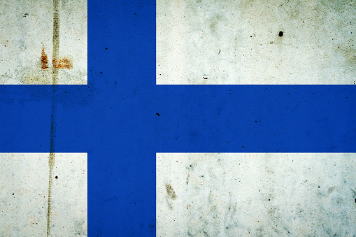 Finland flag on a concrete wall. Flags