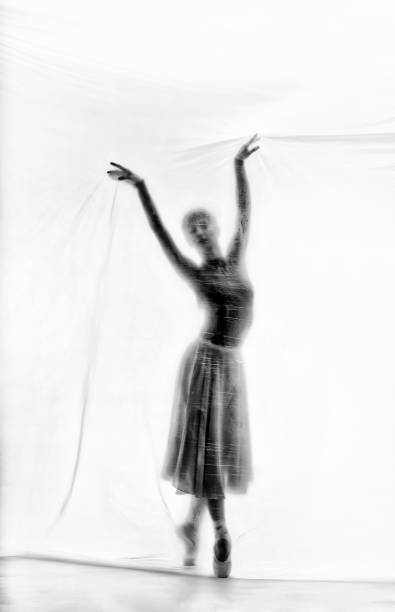 istock Graceful ballerina dancing with transparent nylon 1280863440