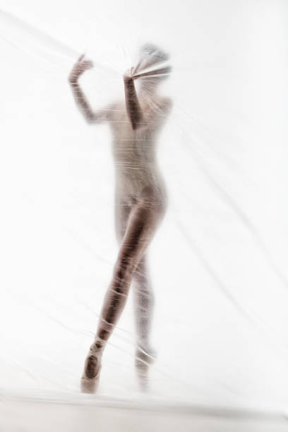istock Graceful ballerina dancing with transparent nylon 1280865312