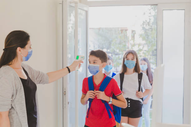 istock Temperature screening and medical check at school. 1280865465