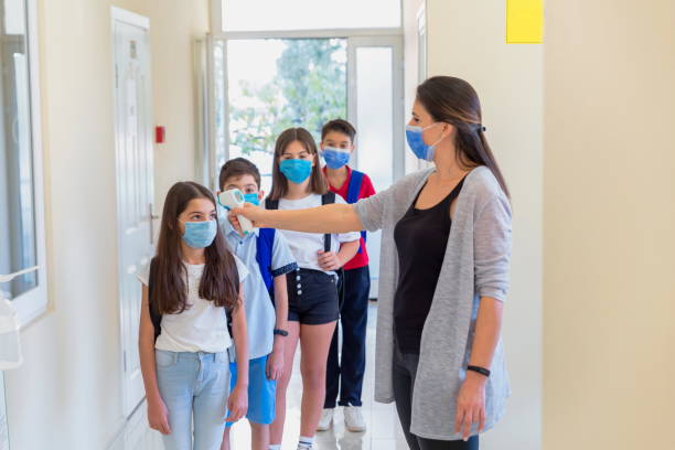 istock Temperature screening and medical check at school. 1280865503