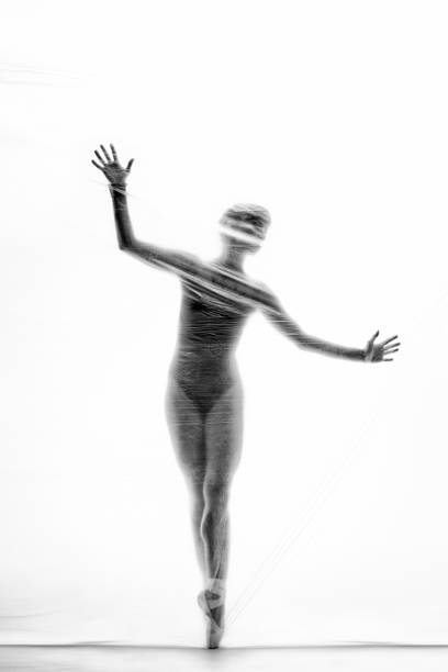 istock Graceful ballerina dancing with transparent nylon 1280865578