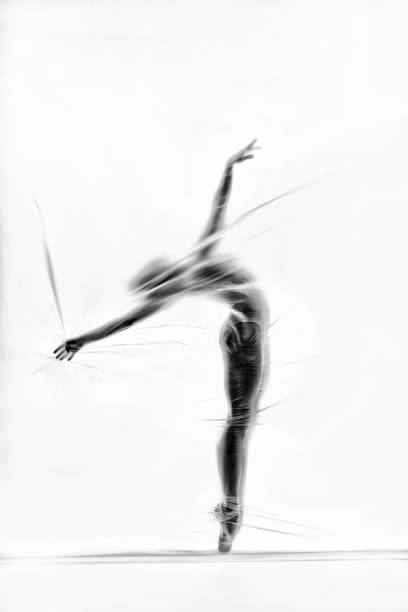 istock Graceful ballerina dancing with transparent nylon 1280866300