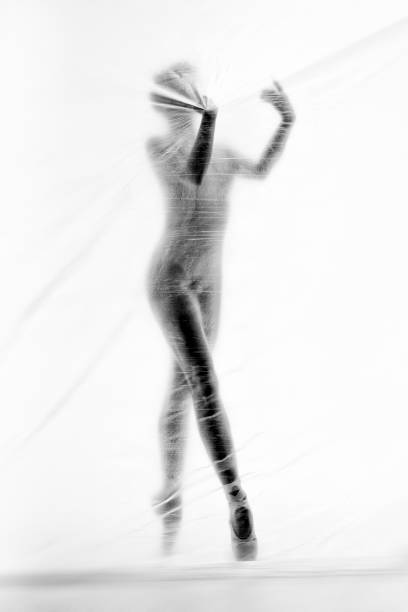 bailarina elegante bailando con nylon transparente - fantasy women blurred motion studio shot fotografías e imágenes de stock