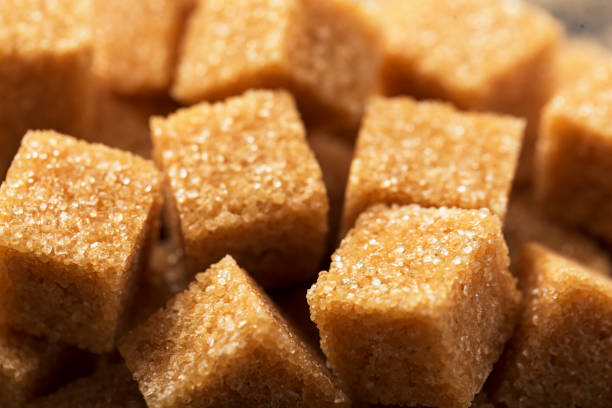 istock Pieces of brown sugar close-up macro 1280868113