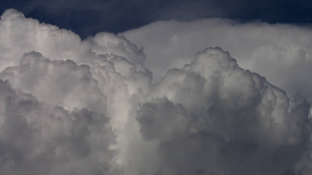 Cumulonimbus in formation Close-up view of menacing budding cumulus clouds cirrus storm cloud cumulus cloud stratus stock pictures, royalty-free photos & images