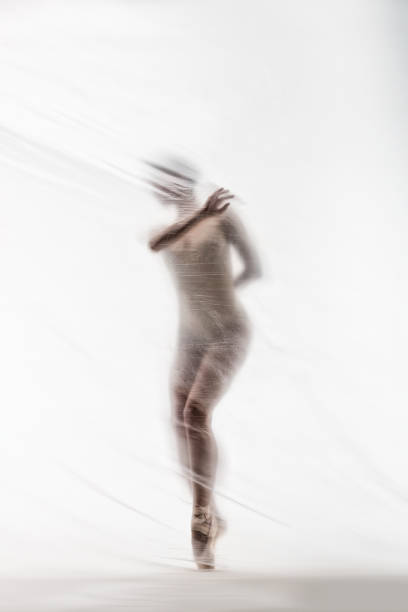 istock Graceful ballerina dancing with transparent nylon 1280868297