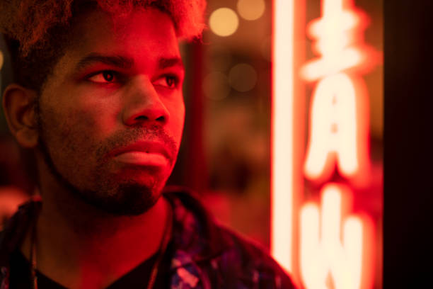 istock A man posing in front of the red neon light 1280869178