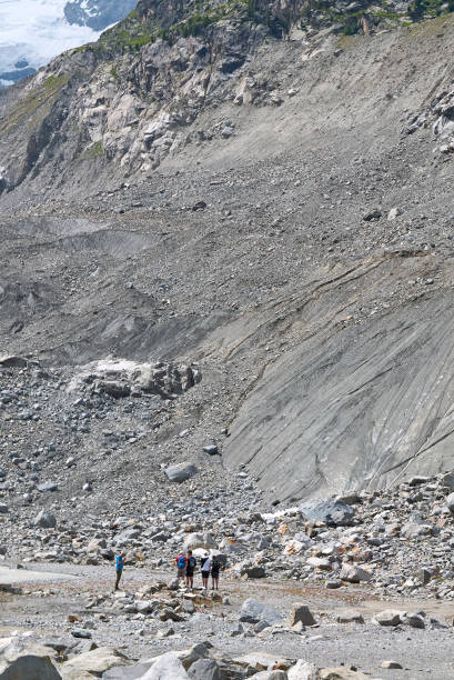 Tourists at Morteratsch Glacier trail Morteratsch Glacier trail Morteratsch, Switzerland - July 22, 2020 : View of Morteratsch Glacier trail 1908 stock pictures, royalty-free photos & images