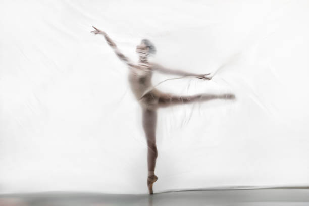 istock Graceful ballerina dancing with transparent nylon 1280869251