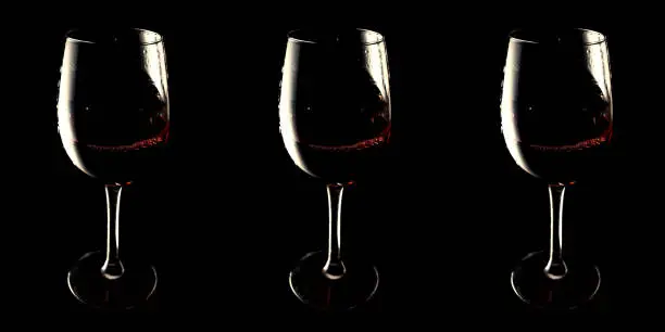 Banner glasses with red wine on black background vinotheque