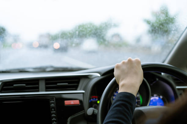 istock Woman driving during the rain 1280871275