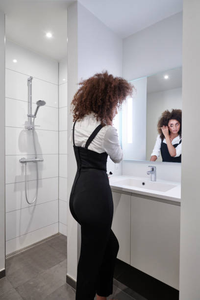 istock Woman in bathroom 1280873559