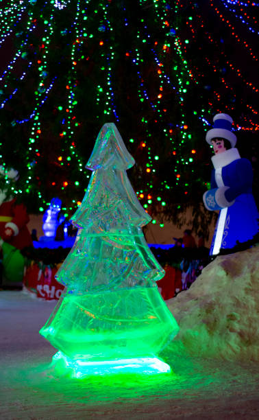 istock Christmas tree made of ice, with green lighting 1280874273