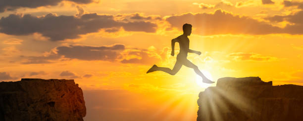 istock silhouette of an obstacle runner between rocks, powerful athlete in beautiful mountain landscape, dynamic symbol for freedom concept 1280877209