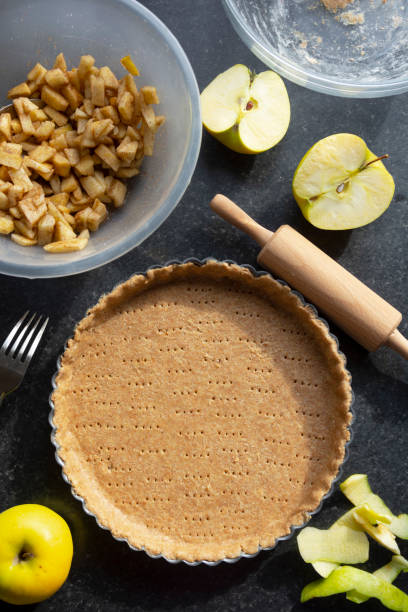 istock Raw shortbread dough for baking tart, apple pie and ingredients for home baking. 1280879000