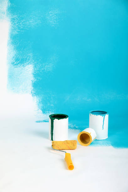 istock Instruments for renovation apartment room isolated on white and blue background. accessories for gluing, painting tools. Colorful paint cans. Concept of repair home. Copy space for advertisement 1280879378
