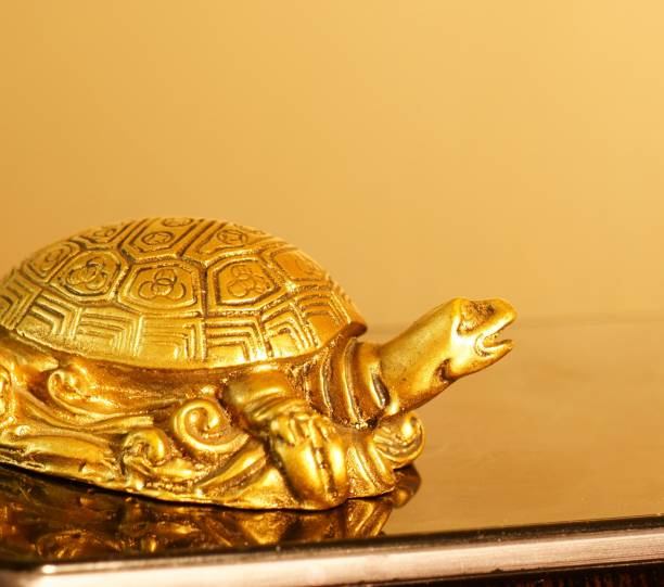 istock Metal turtle on your smartphone. 1280881024