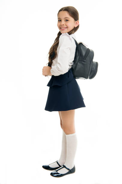 istock Right and wrong ways to wear backpack to prevent pain. Learn how fit backpack correctly for school. Schoolgirl cute in formal uniform wear backpack. School backpack concept. Follow these tips 1280881731