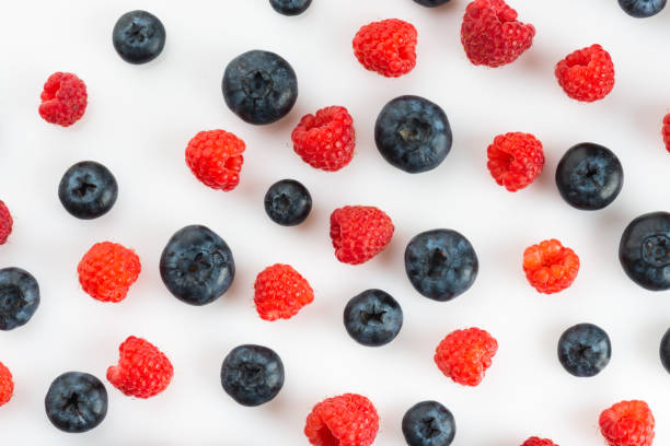 istock Fresh blueberries and raspberries, top view 1280883638
