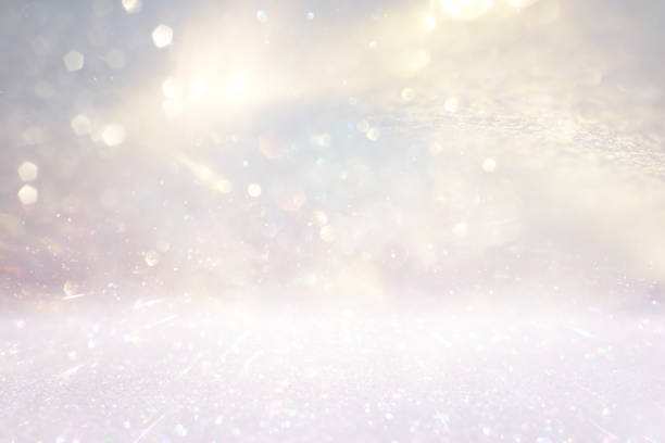 istock glitter vintage lights background. silver, gold and white. de-focused 1280883767
