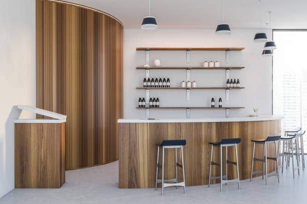 istock Modern white and wooden round bar interior 1280886043