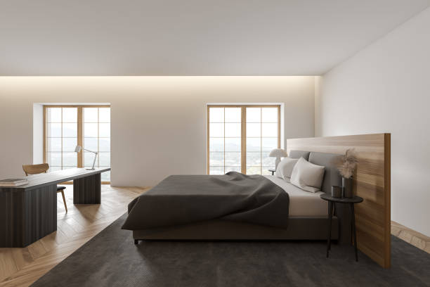 istock Modern white and wooden master bedroom with home office, side view 1280887138